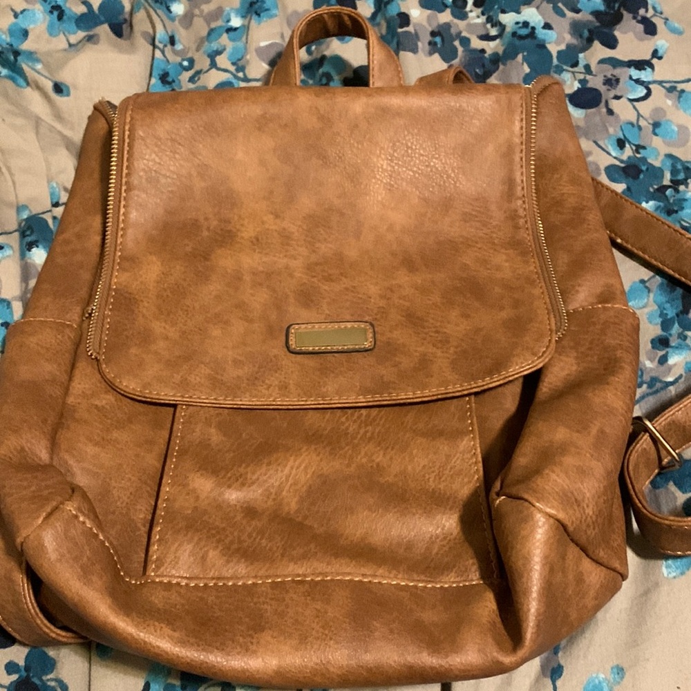 Cute brown leather back pack bag